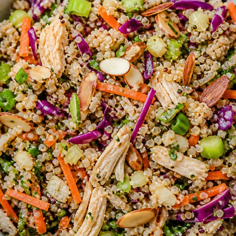 Quinoa salad with rotisserie chicken and fresh vegetables in a bowl